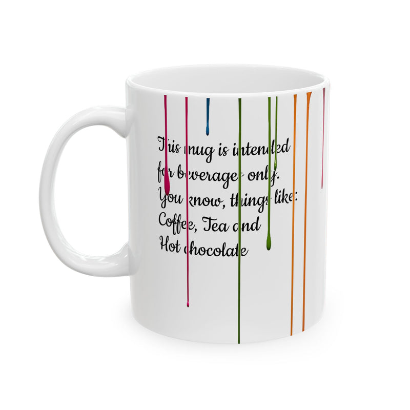 Vibrant 11oz Paint Drips Mug, Ceramic Coffee Cup with a colorful rainbow design resting on a modern kitchen counter.