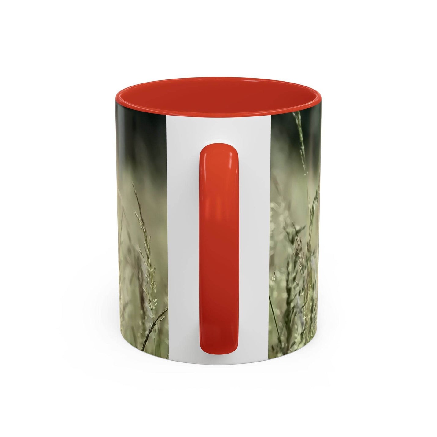 Premium 11oz Mug, Flowering Grass - Bring Nature Inside on a shelf, featuring a red handle and red inside.