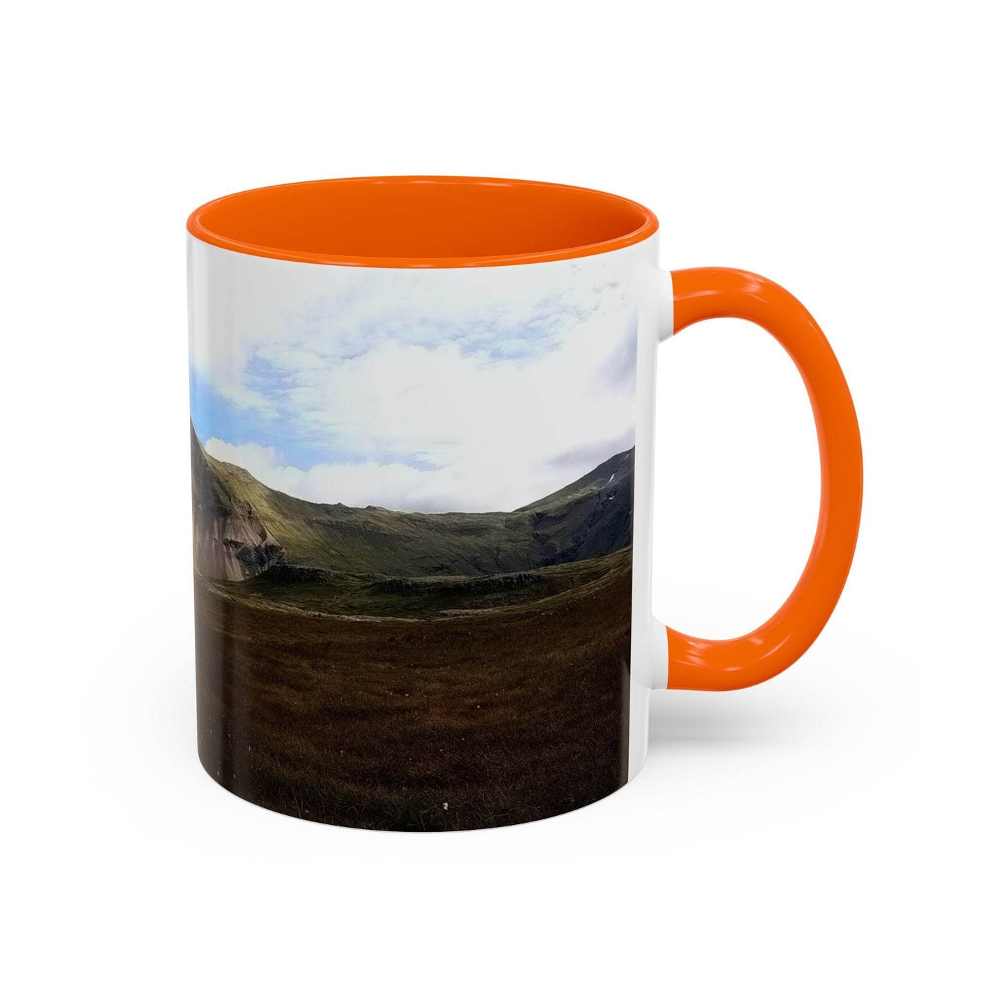 Premium 11oz nature Coffee Mug - Iceland Scenery showing the orange handle and orange inside outdoors.