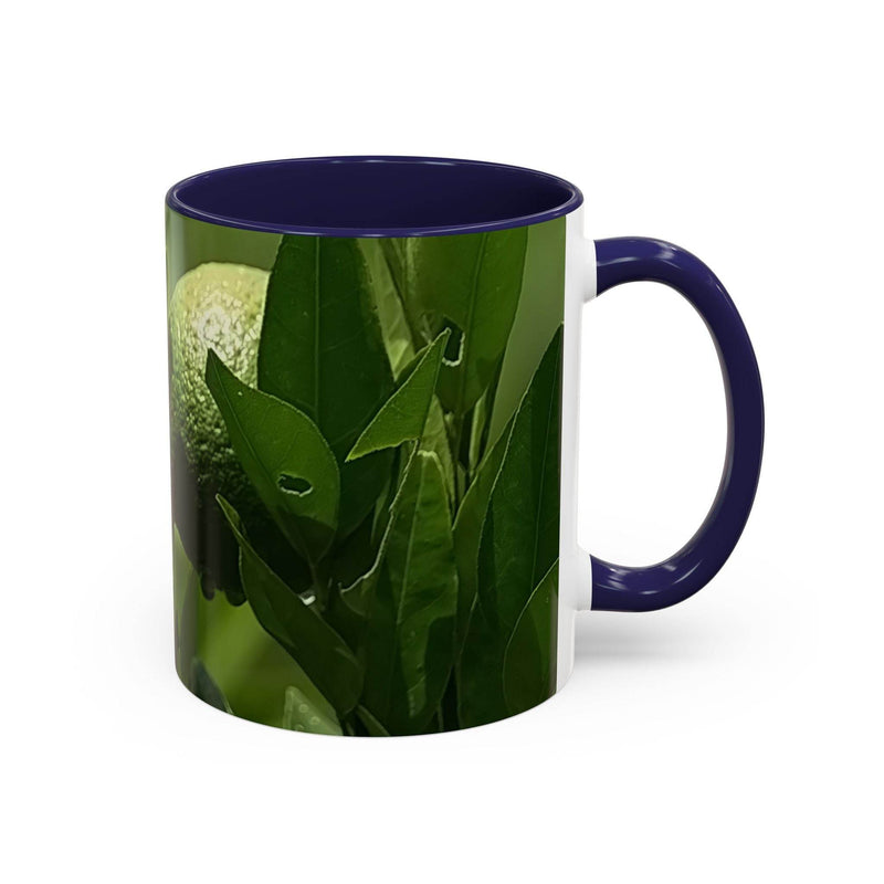 Glossy 11oz Fruit Mug showing its navy handle and navy inside beside colorful kitchenware elements.