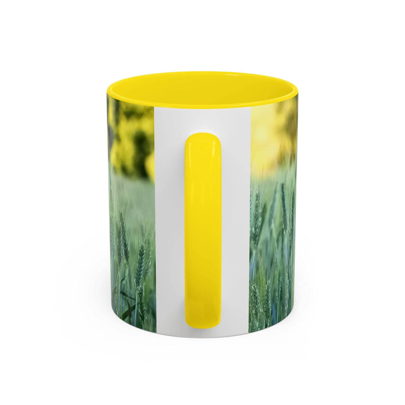 Premium 11oz Mug - Wheat Field Design Coffee Mug on wood, displaying its vibrant yellow handle and yellow inside.