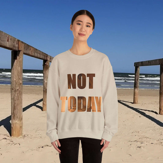 Cozy Unisex Crewneck sweatshirt with "Not Today, Maybe Tomorrow" text displayed on a beach.