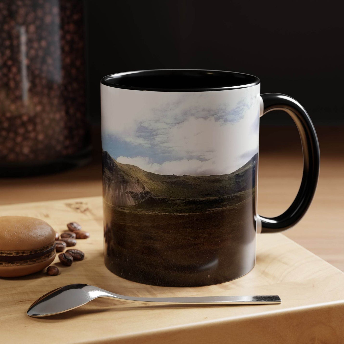 Nordic landscape 11oz Coffee Mug - Iceland Scenery in use, showing its black handle and black inside.