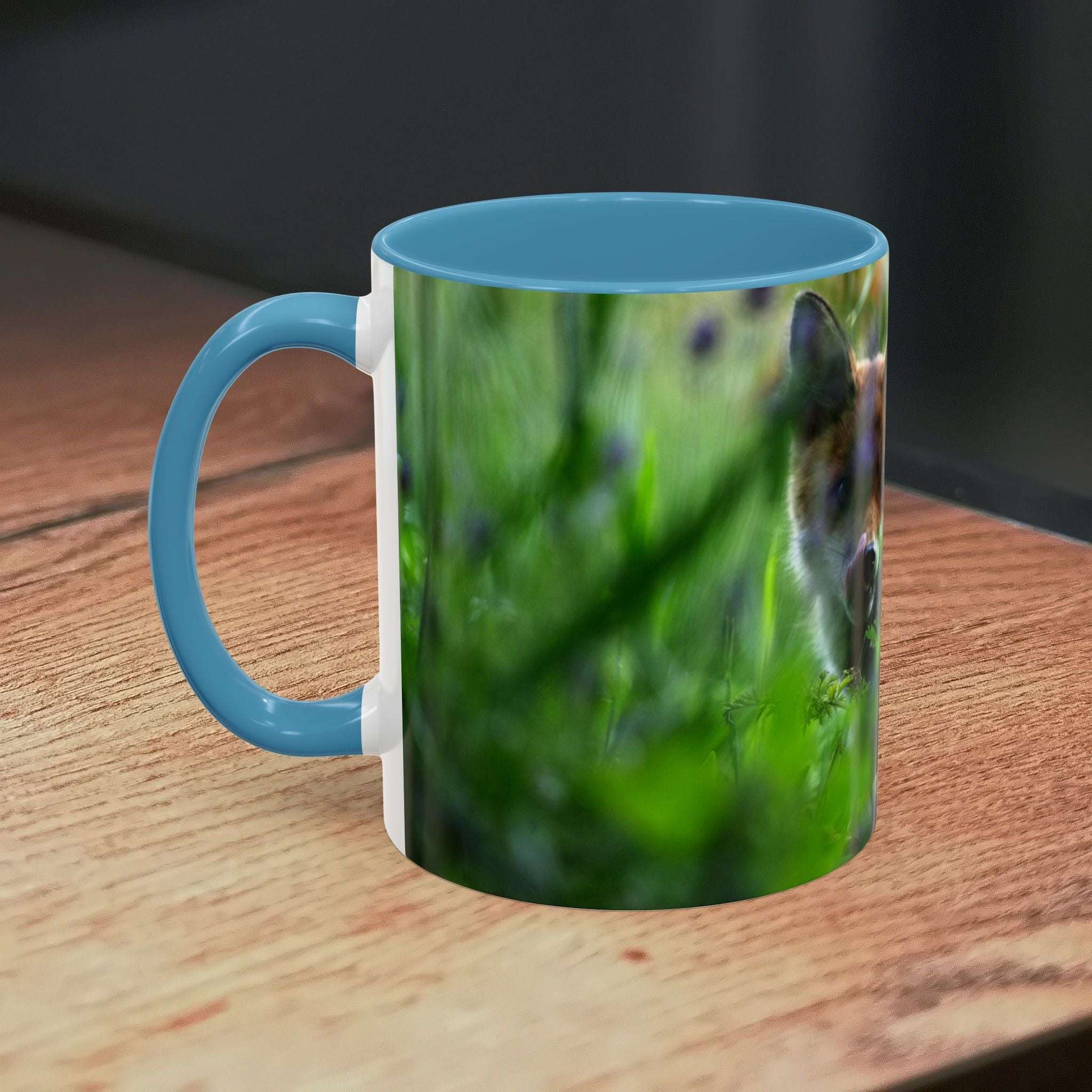 Fox-inspired accent coffee mug with nature design on wooden table.