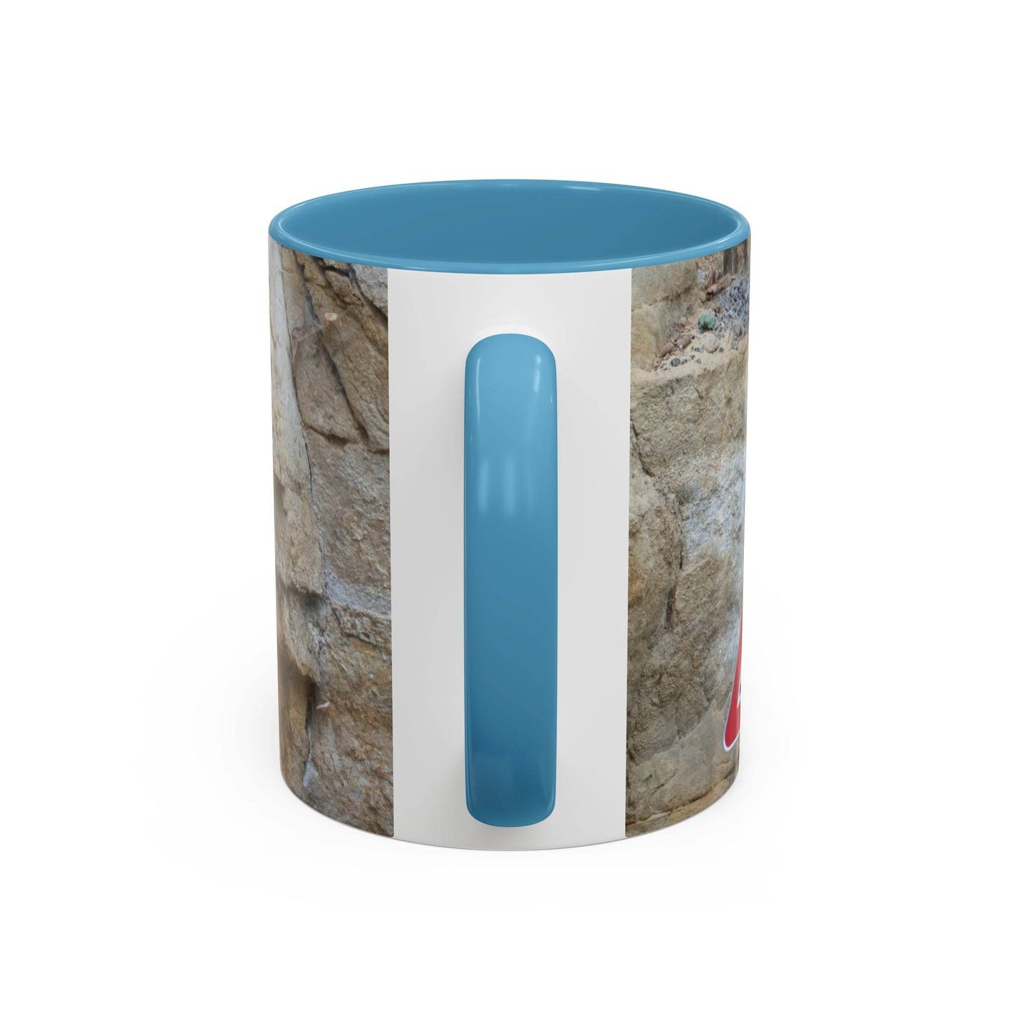 Outdoorsy 11oz Rocky Mug, Mountain Lovers, Danger of Falling Rocks on a stool, showcasing its light blue handle and inside.