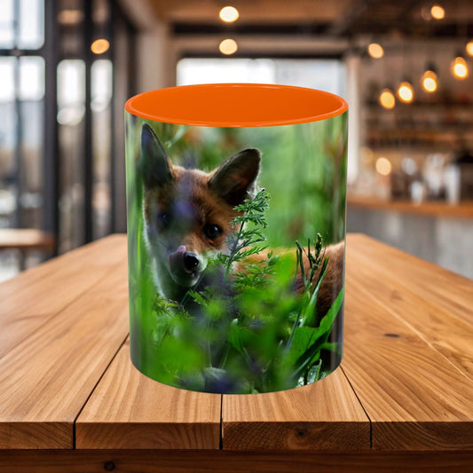 Wildlife Fox Ceramic Mug with forest design on a wooden table in a cozy setting.