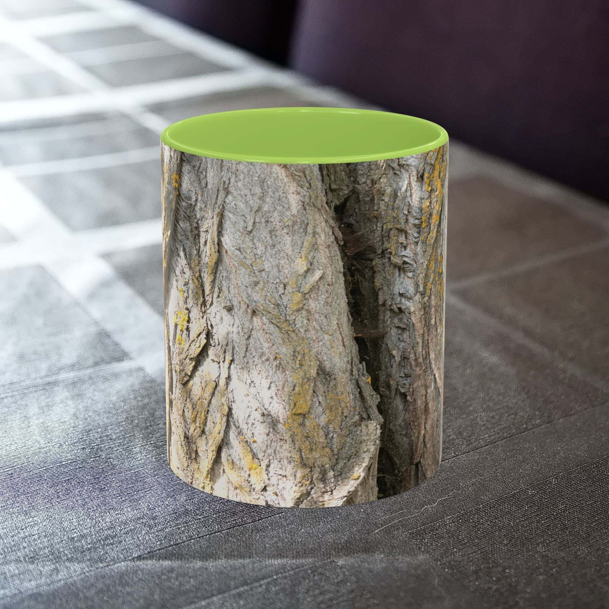 Coffee mug with tree trunk design on a table, showcasing a rustic and nature-themed aesthetic.