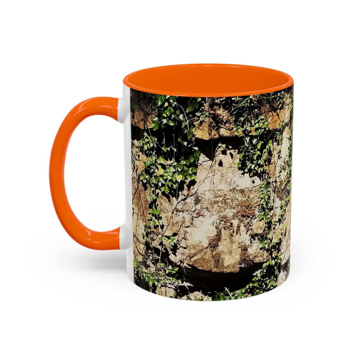 Robust 11oz Mug - Overgrown Rocks Adventure Coffee Mug with an orange handle and orange inside on a table.
