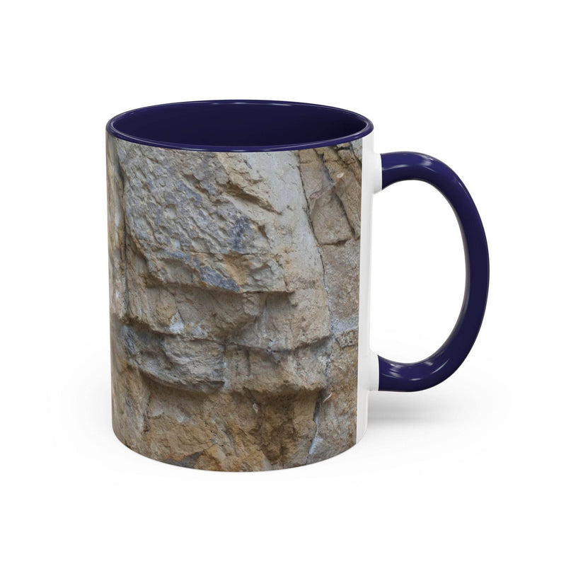 Premium 11oz Rocky Mug, Mountain Lovers, Danger of Falling Rocks on a tray, featuring a navy handle and navy inside.