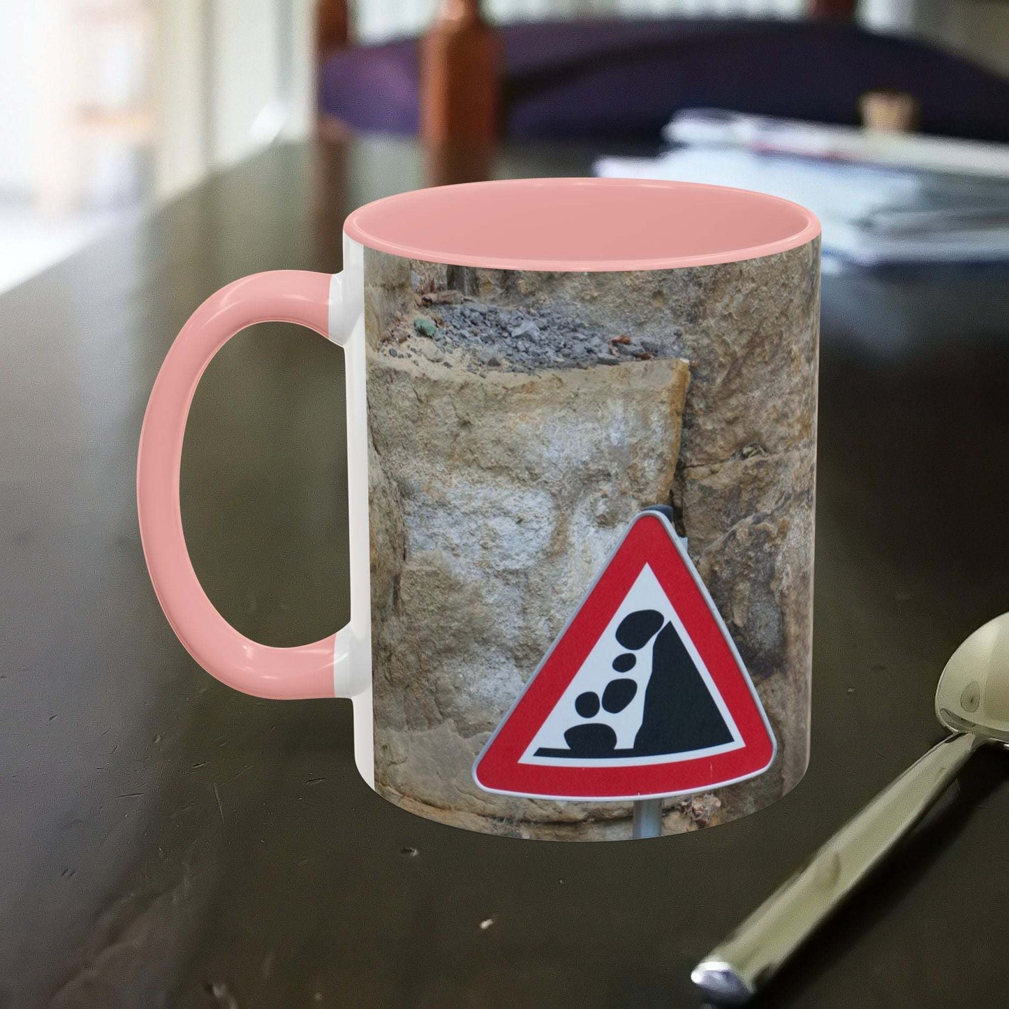 Rocky Mug with mountain design featuring falling rocks warning sign.