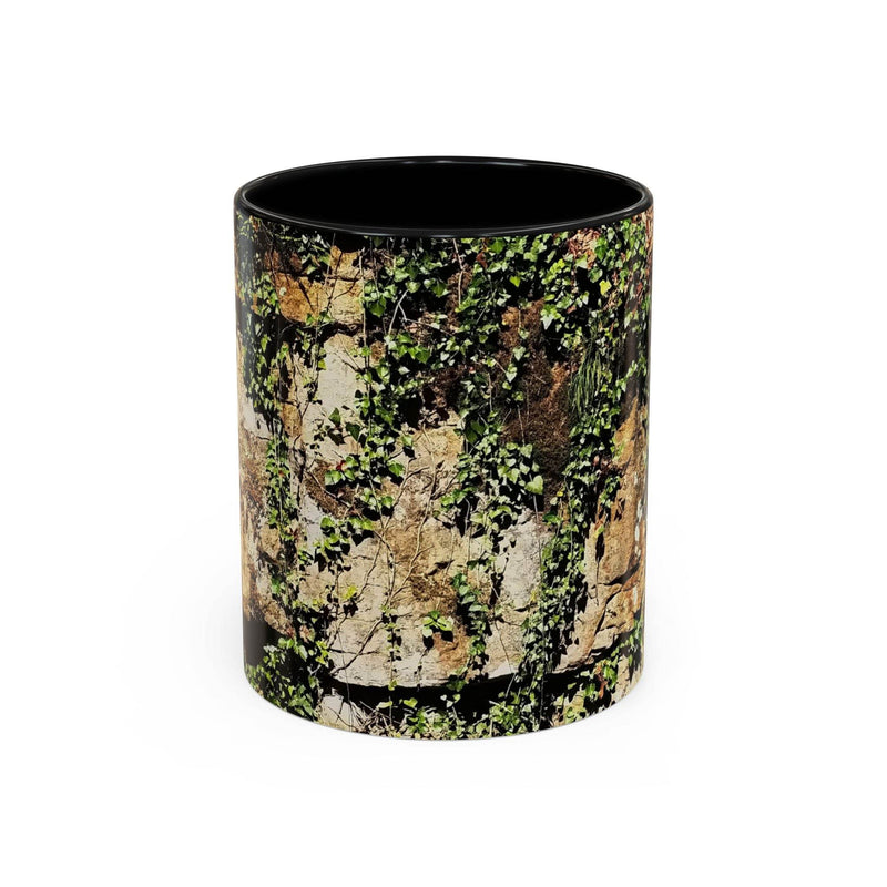 Adventurous 11oz Mug - Overgrown Rocks Adventure Coffee Mug showing the black handle and black inside near stones.