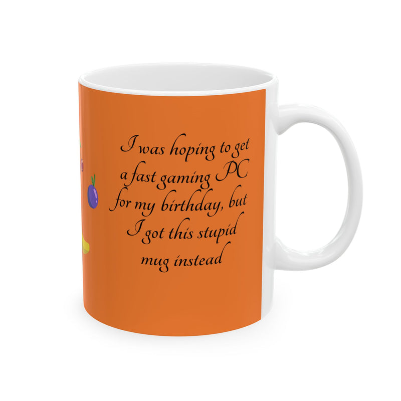 Cheeky 11oz orange Coffee Mug — 'I got a stupid mug for my birthday' by a bright, sunlit room window.