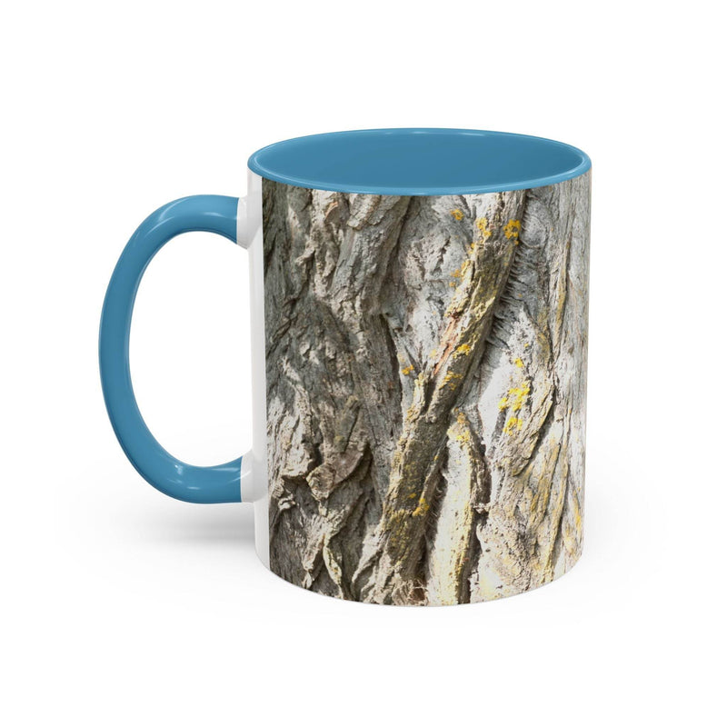 11oz rustic Coffee Mug - Tree Trunk Design with a light blue handle and light blue inside on a counter.