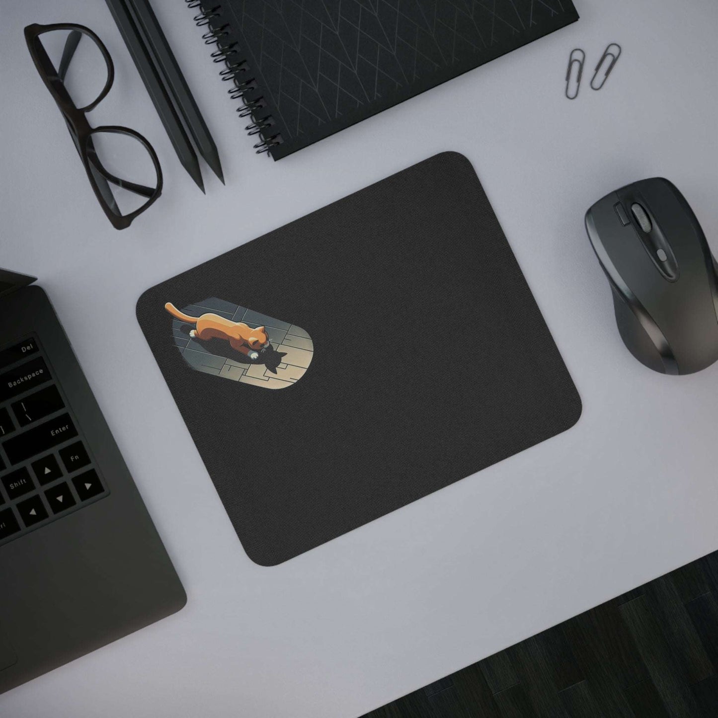 Cat mouse pad with playful cat design on a desk, ideal for animal lovers.