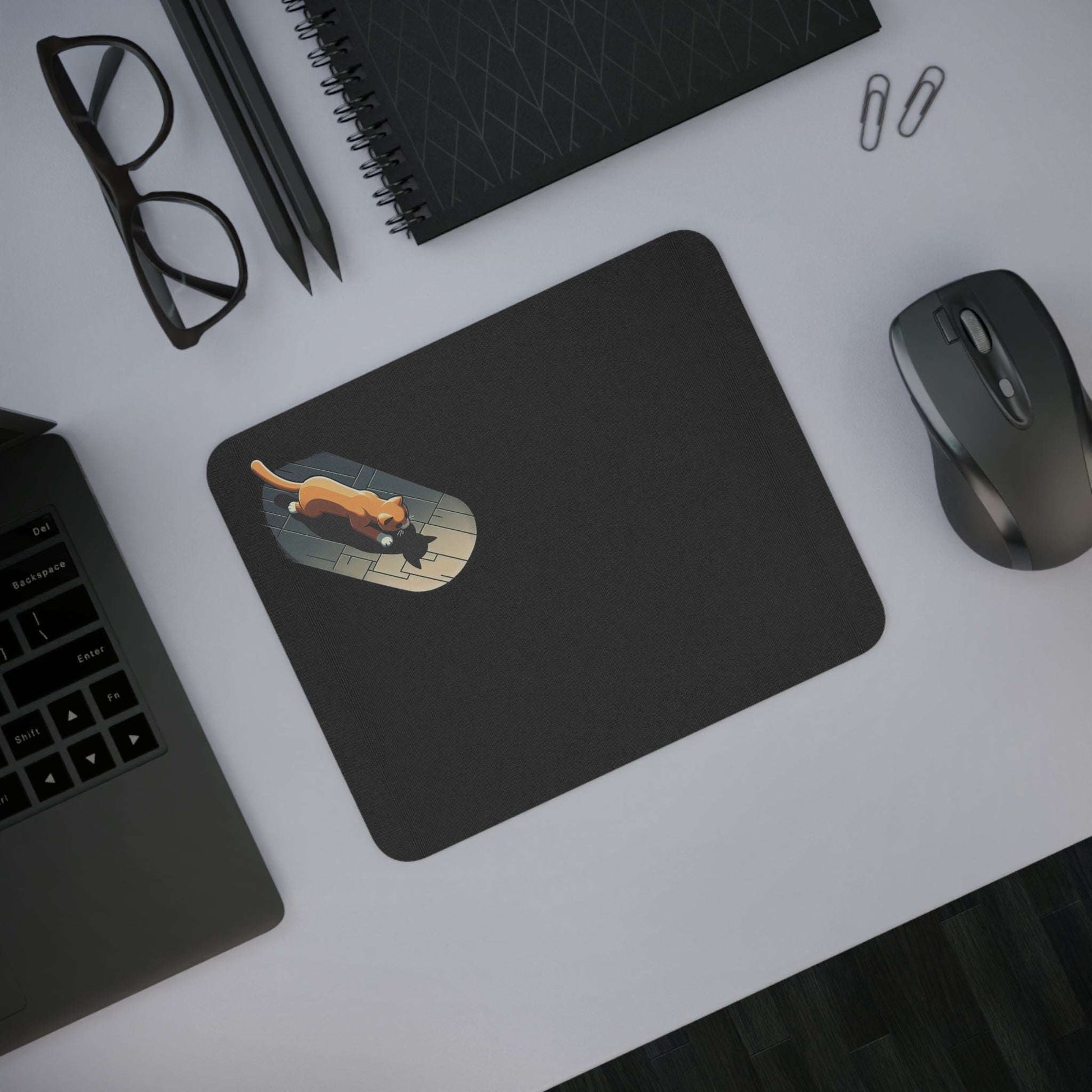 Cat mouse pad with playful cat design on a desk, ideal for animal lovers.