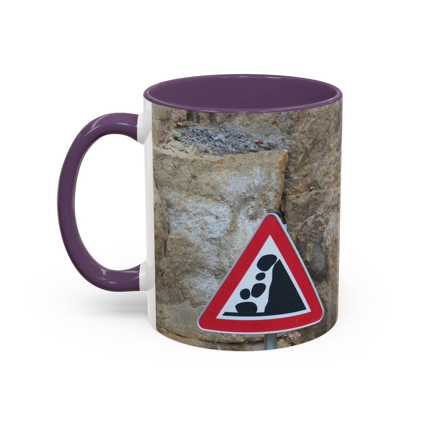 Adventurous 11oz Rocky Mug, Mountain Lovers, Danger of Falling Rocks with a purple handle and purple inside on a desk.