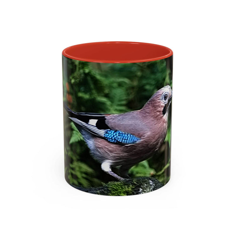11oz colorful jay coffee mug with a red handle and red inside.