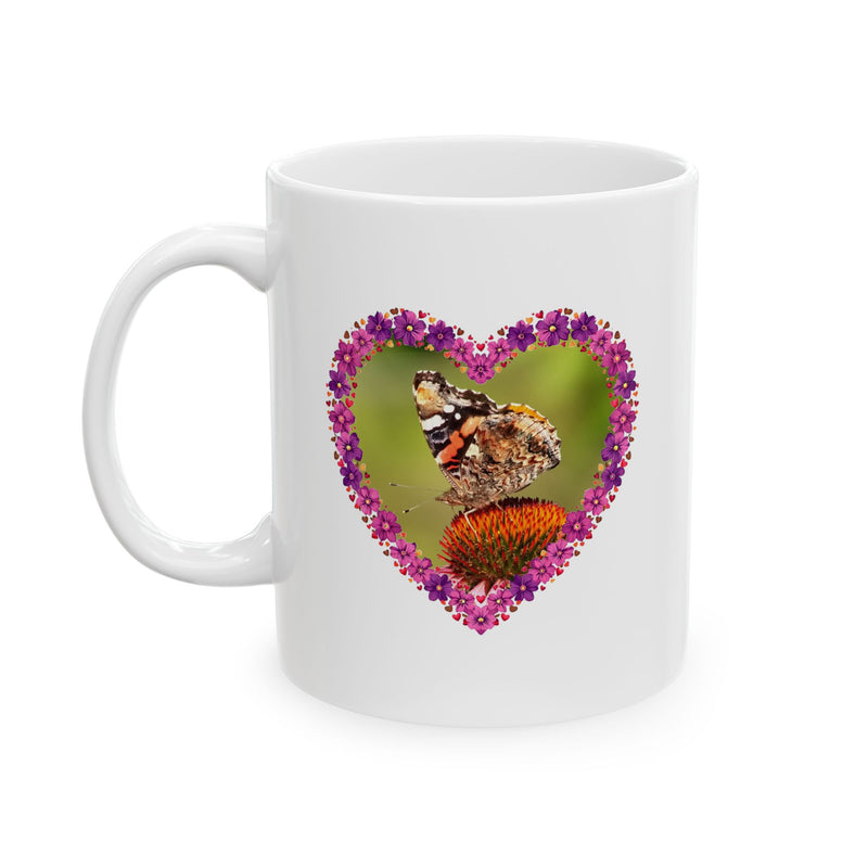 Glossy 11oz Heart Flower Frame Butterfly Ceramic Mug showing pink and purple floral artwork on a modern countertop.